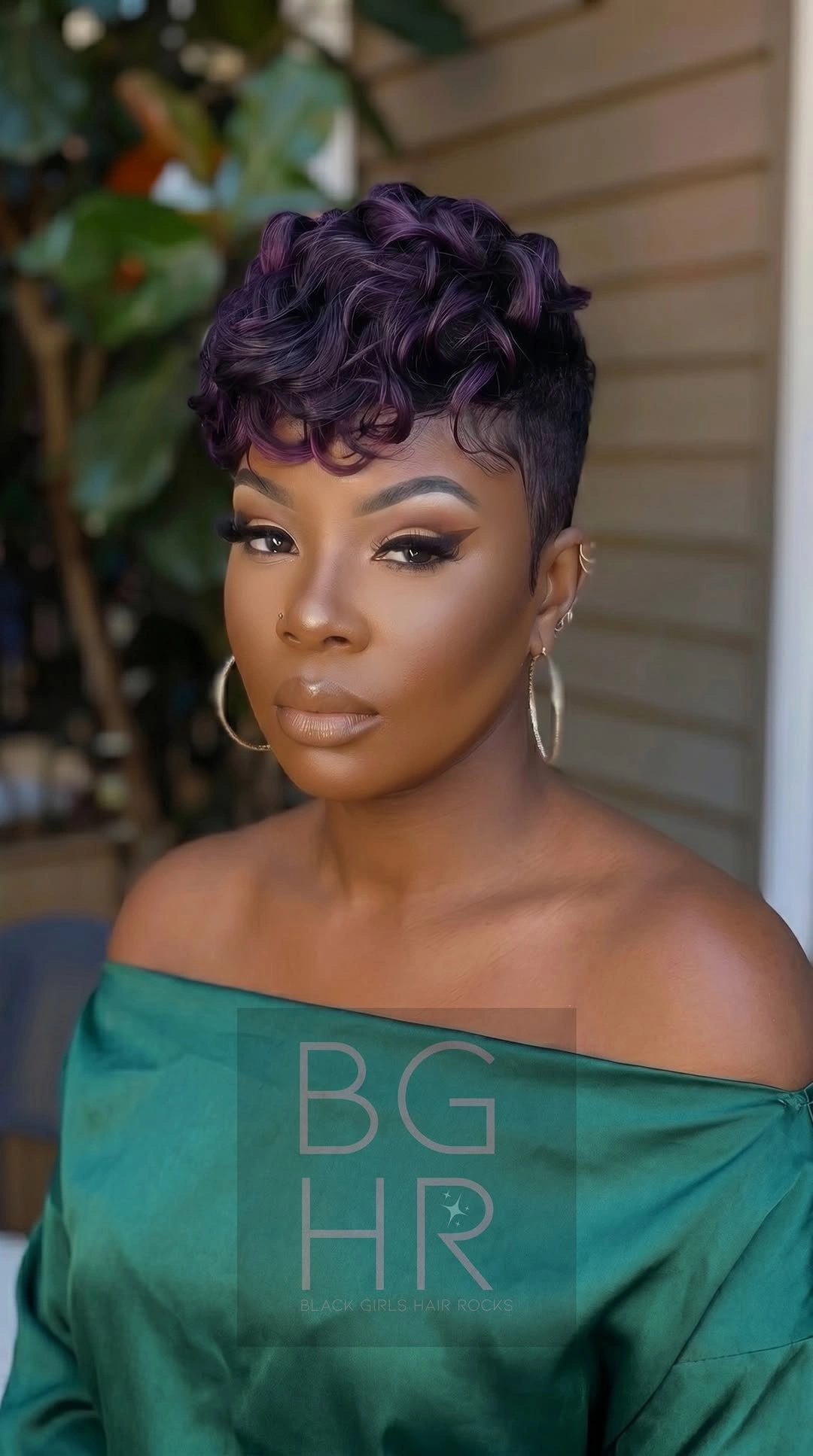 Short plum curly pixie with close sides and defined top