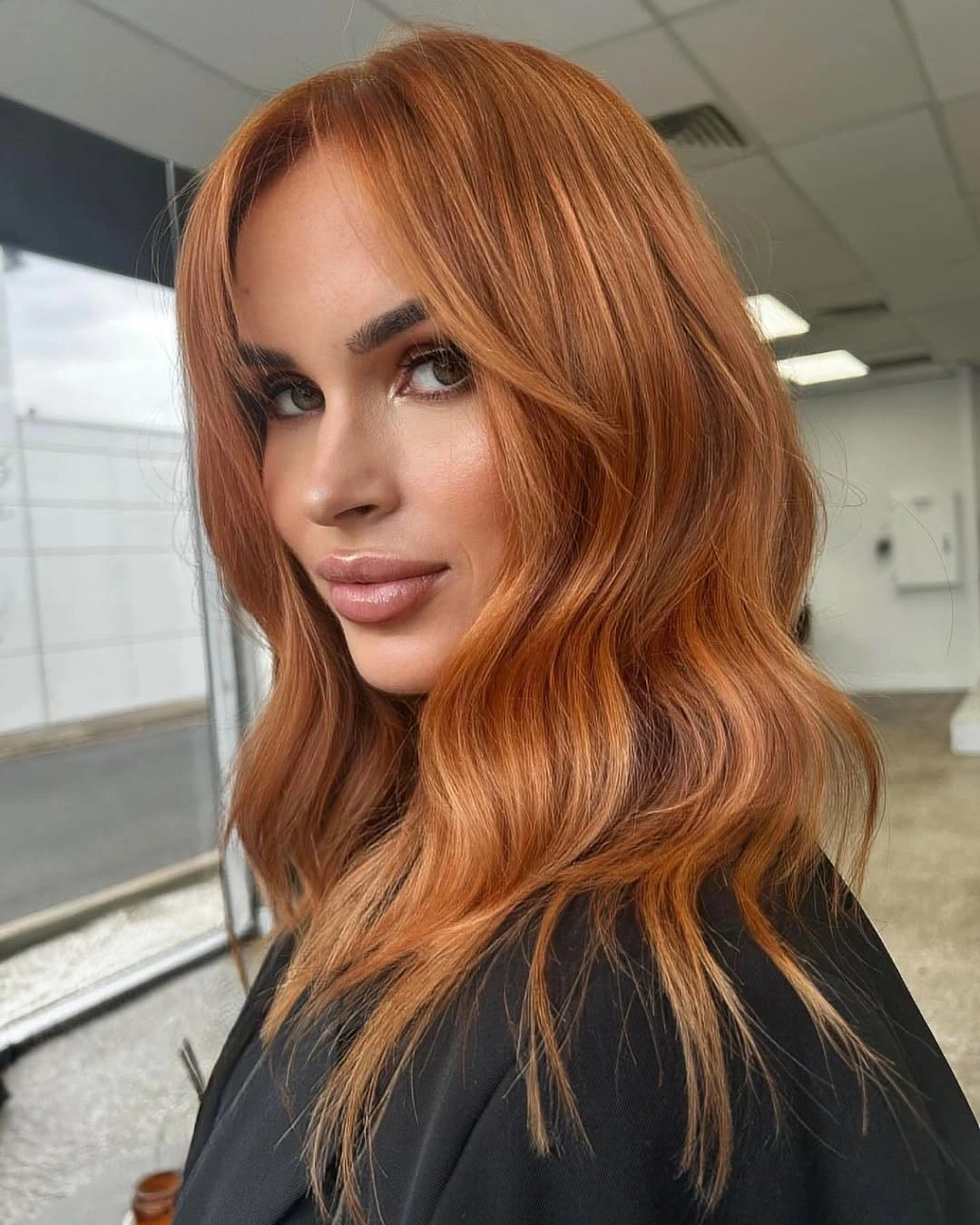 Medium length copper orange waves with soft front pieces