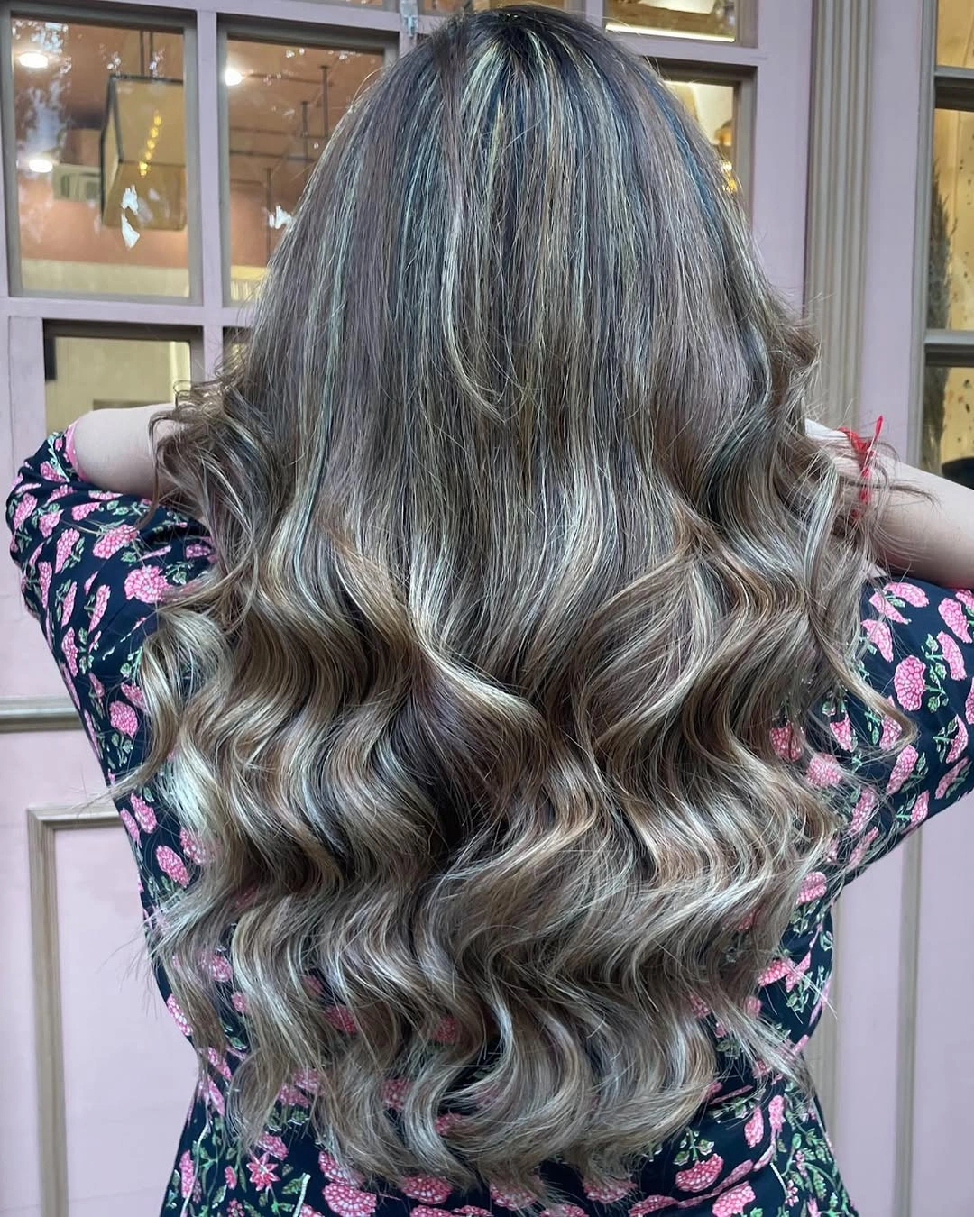 Long wavy smoky silver hair with darker brunette interior
