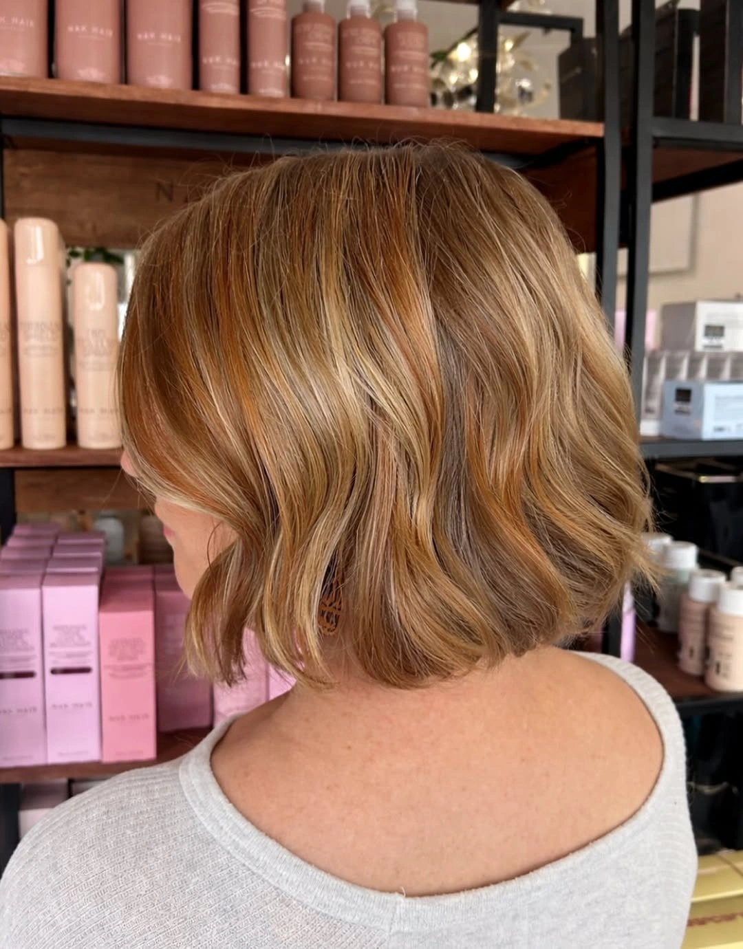 Short wavy copper bob with golden brown pieces