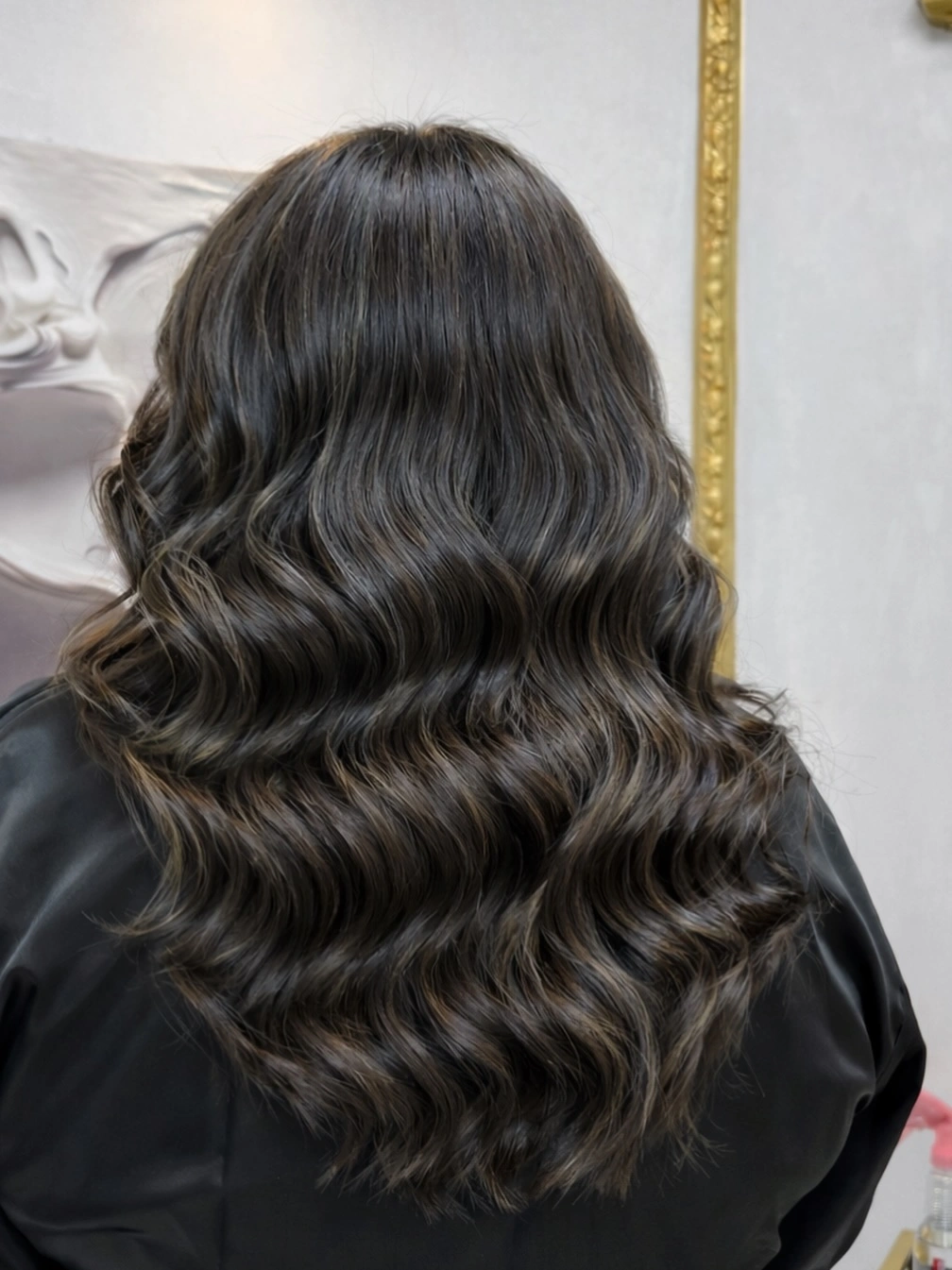 Long black brown waves with subtle charcoal reflections