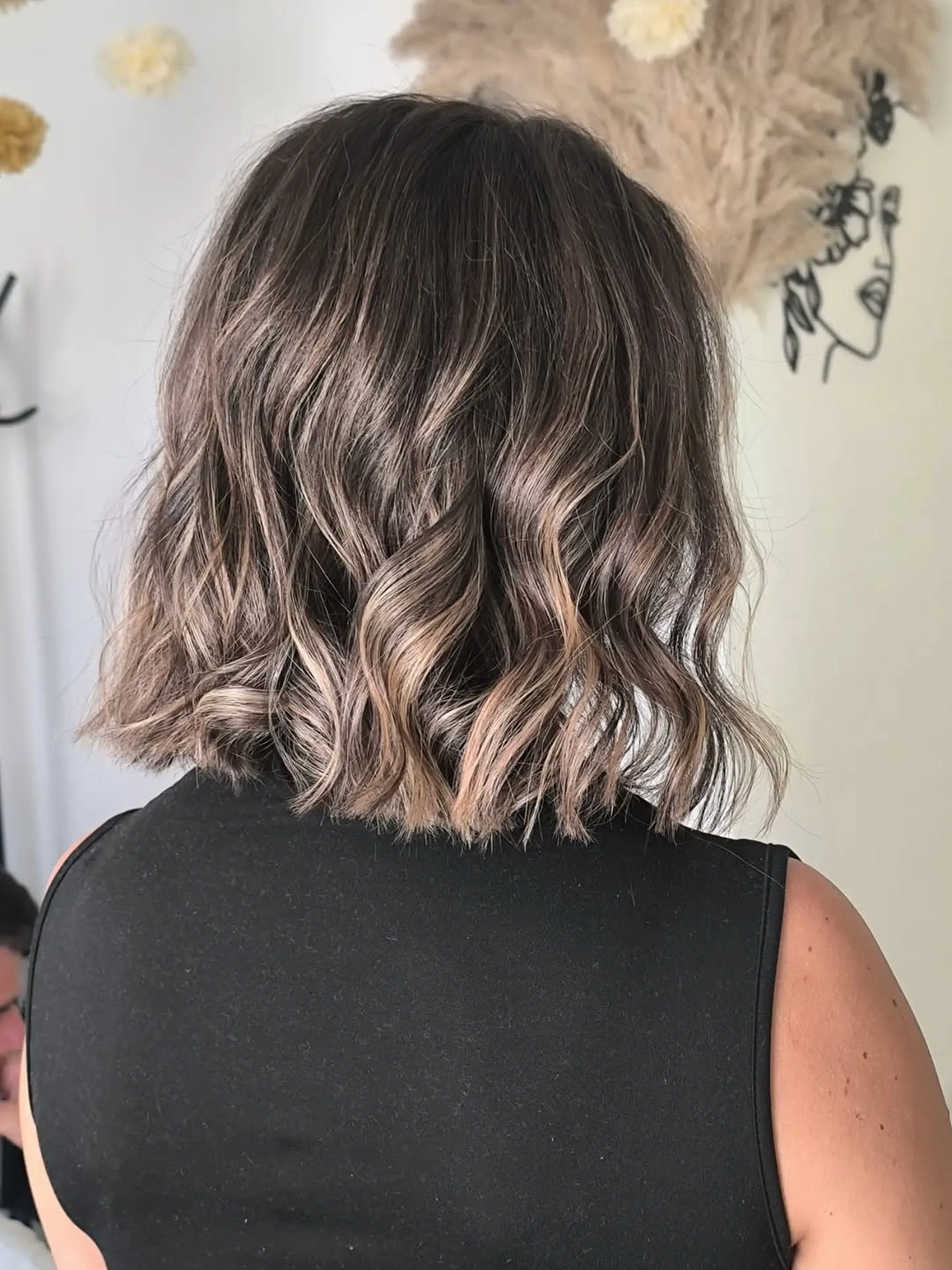 Short gray lavender wavy bob shown from the back