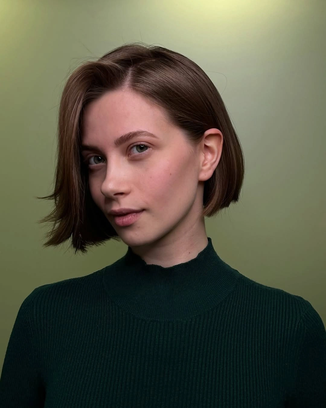 Short dark asymmetrical bob with a side sweep