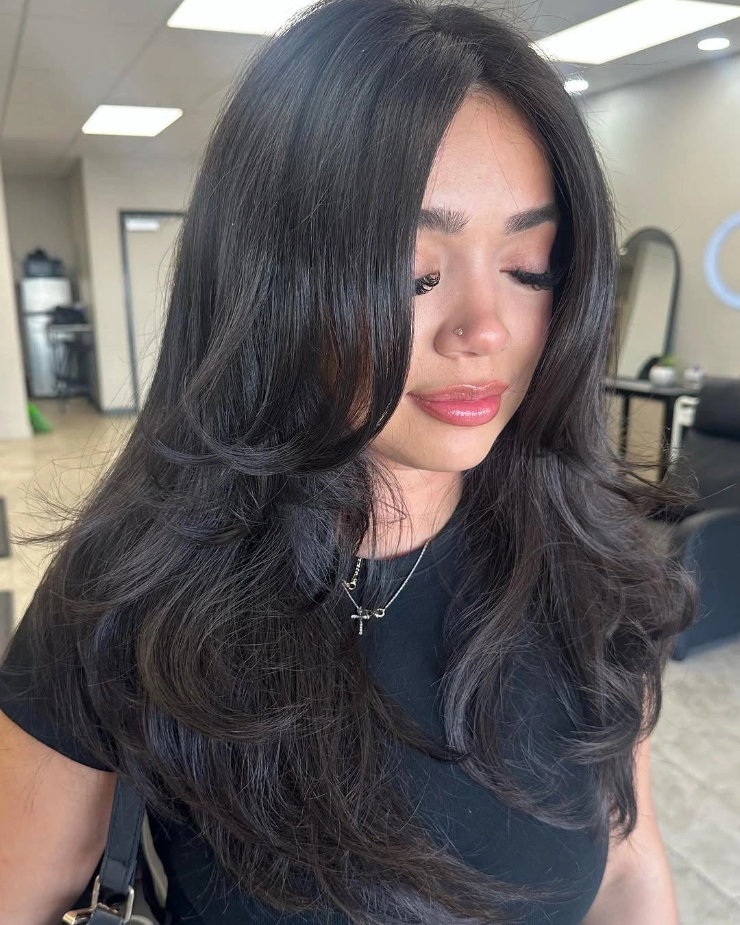 Long black layered haircut with face framing pieces