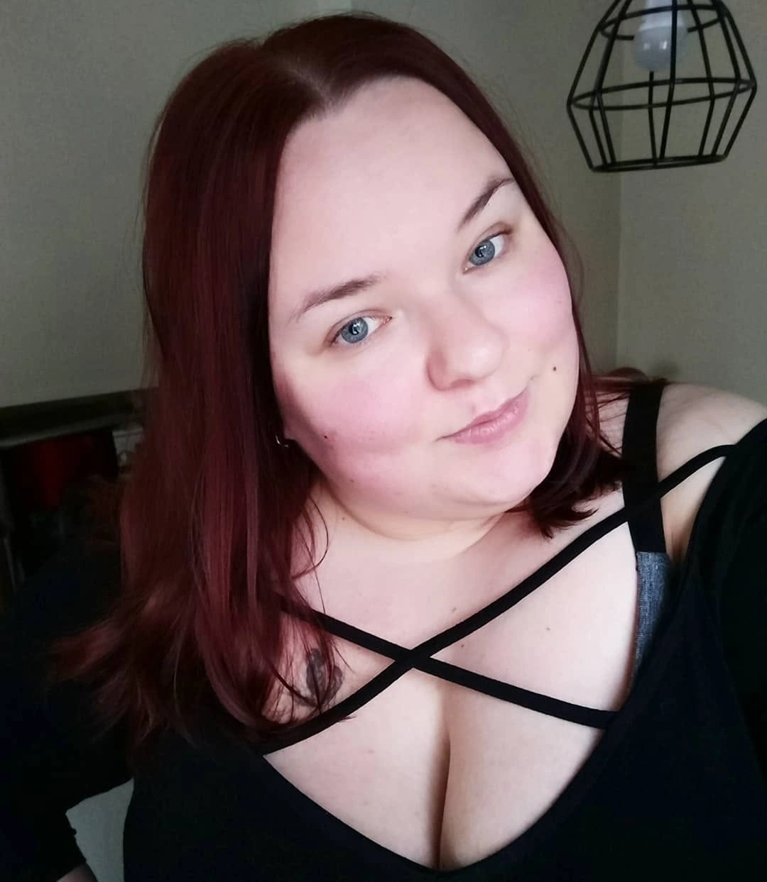 Burgundy long bob with smooth sides and curved ends
