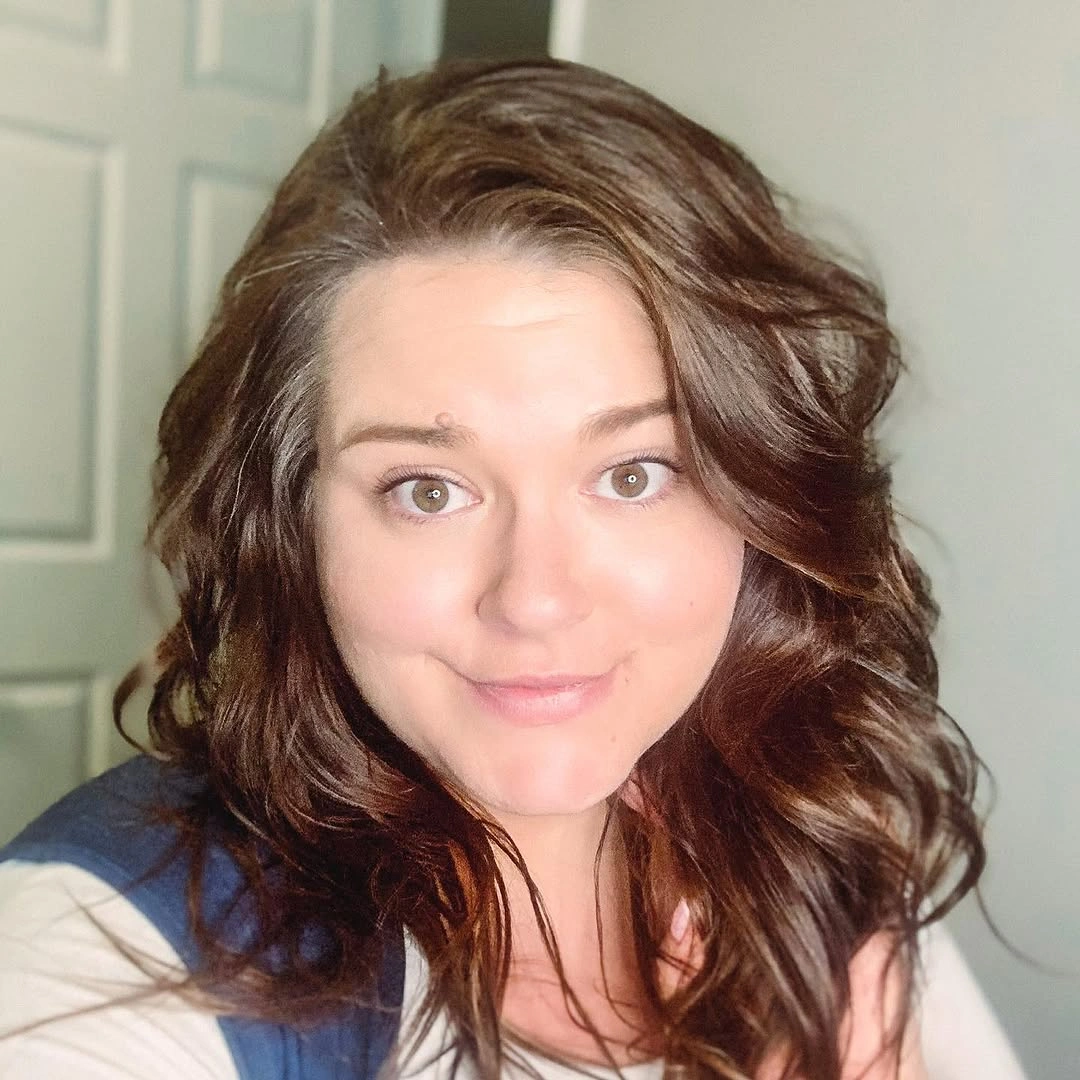 Shoulder-length brown waves with deep side part
