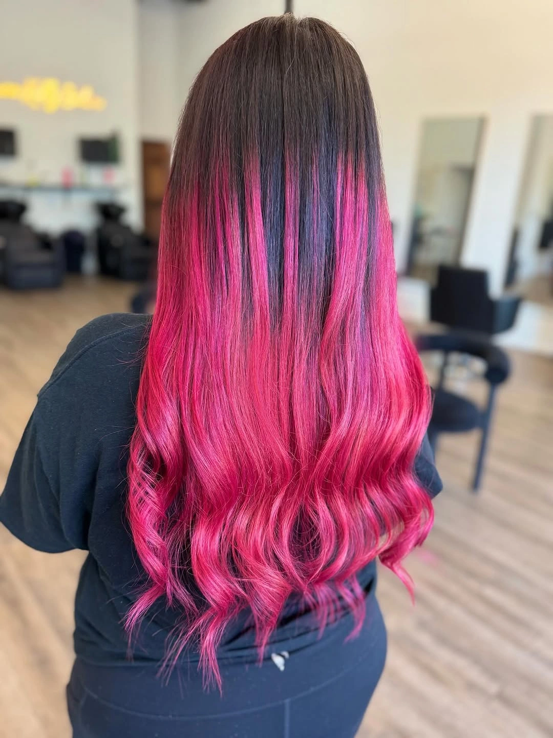 Long dark hair with pink lower color and wavy ends