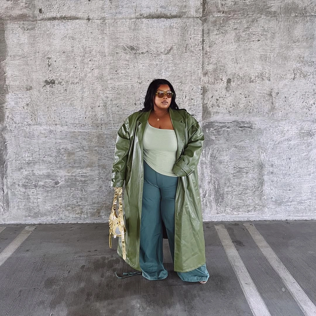 Long olive coat with pale green top and wide pants