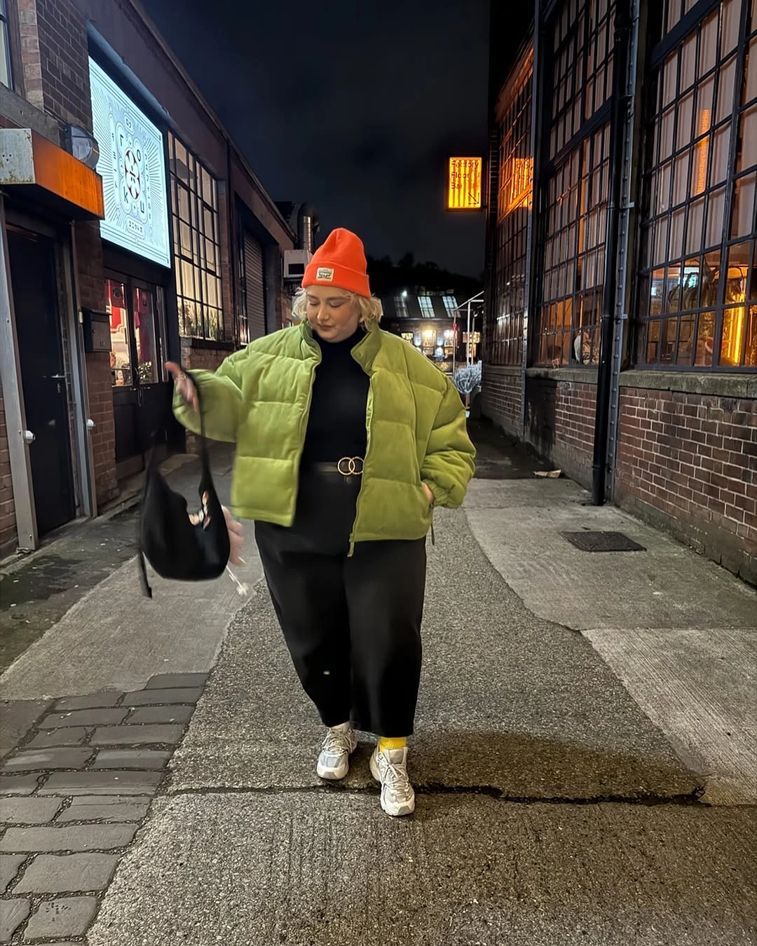 Lime cropped puffer with orange beanie and black outfit
