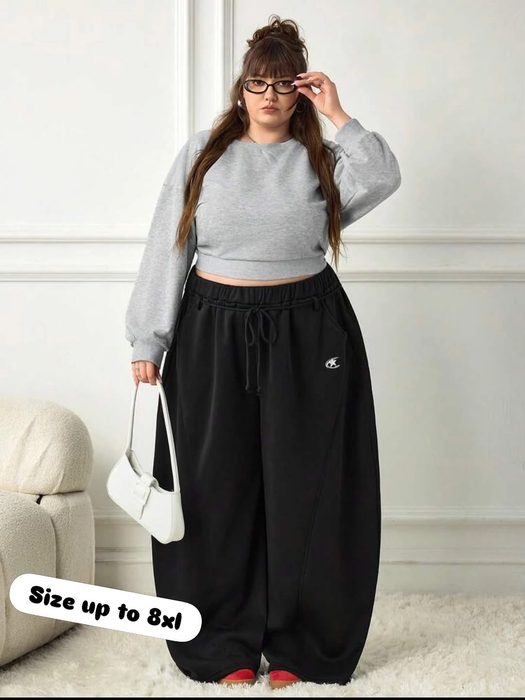 Gray cropped sweatshirt with wide black drawstring pants