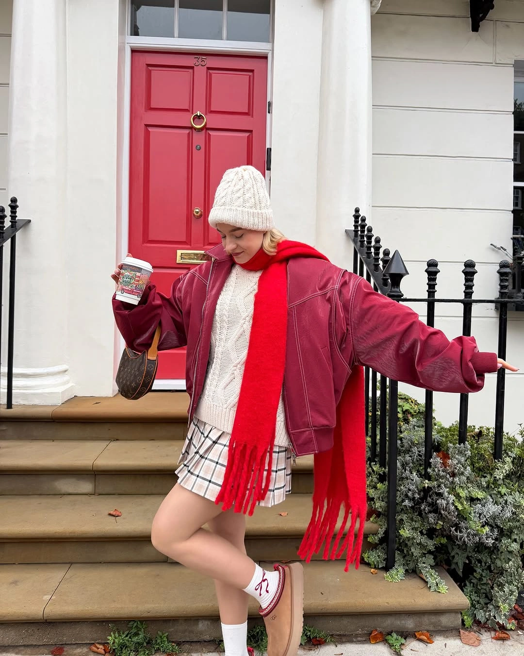 Berry red jacket and scarf with checked mini skirt and sneakers