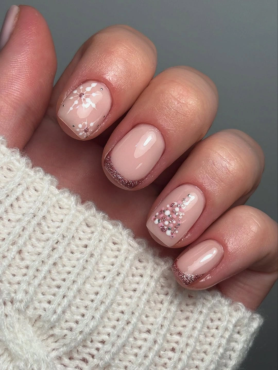 Very short nude nails with rose gold glitter edges