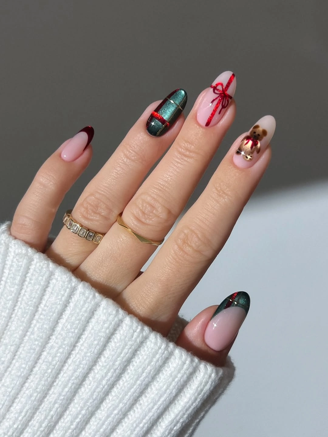Almond nails with green plaid red bow-like art